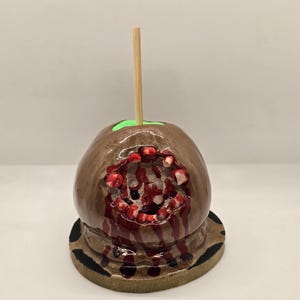 Caramel apple with toothy bite horror sculpture. Hand sculpted polymer clay- collectable, unique gift, Christmas Gift-weird stuff-cool stuff