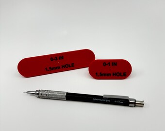 Board centering tool.  Find the center of any side of material up to 3" thick with a 0.5mm mechanical pencil.