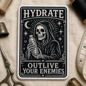 May include: Black and white embroidered patch featuring a grim reaper holding a water bottle. The patch has the words "HYDRATE" and "OUTLIVE YOUR ENEMIES" in white lettering. The design includes a crescent moon, stars, and a decorative border.