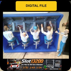 May include: A blue diorama scene featuring miniature figures of people in a control room, with screens displaying a race. The text "DIGITAL FILE" is at the top. The bottom of the image has the text "Slot13200" and "STL Files for Slot Cars & Dioramas".