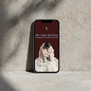 May include: A smartphone displaying a dark red screen with the text "the 3am checklist" and "for the nights when your brain won't let you sleep." Below the text is an illustration of a person sitting with their knees pulled to their chest.