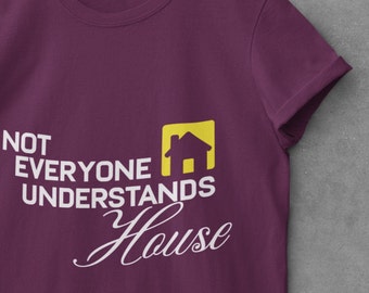 May include: Purple t-shirt with white text that reads "Not everyone understands house" with a yellow house icon.