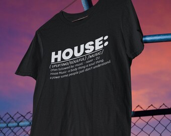 May include: Black t-shirt with white text that reads "HOUSE: (UPLIFTING/SOULFUL)/MUSIC/ Often followed by: music-raver-DJ House Music-a body thing a soul thing. a power some people just don't understand."