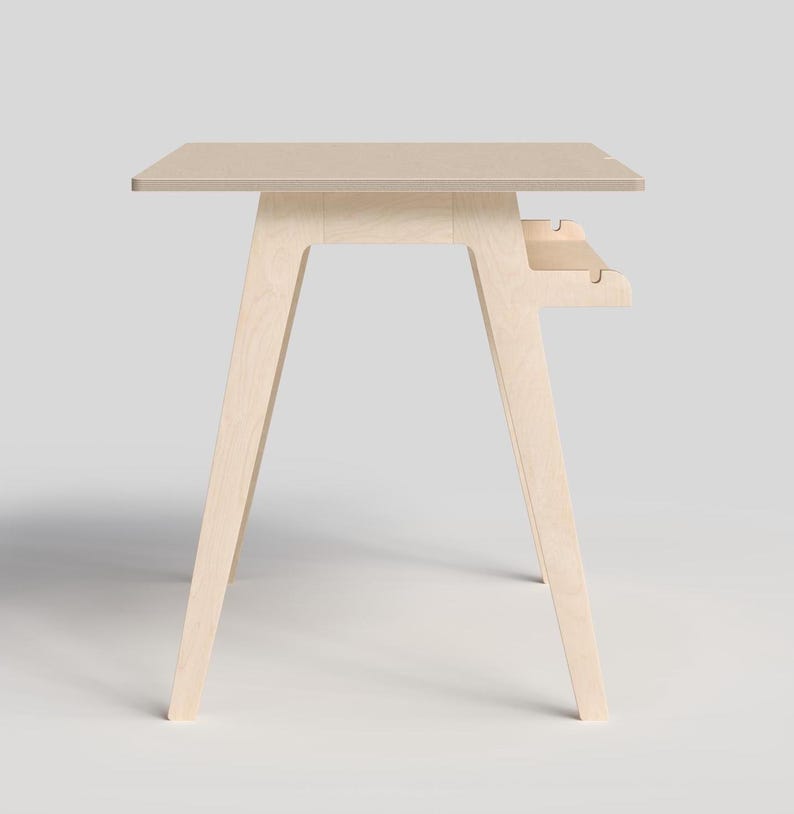 May include: A light wood desk with a simple design and a small shelf underneath the desktop.