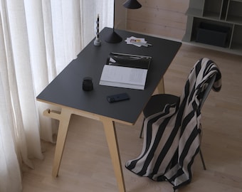 Scandinavian birch plywood desk for home office or children's room. Graphite dark gray color.