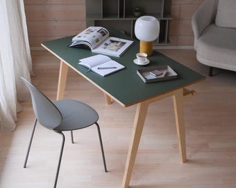 Scandinavian birch plywood desk for home office or children's room. Green color.