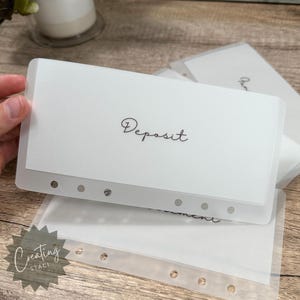 May include: White plastic dividers with holes for a binder. The dividers have the words "Deposit" and "Payment" printed on them.