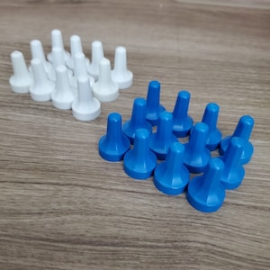May include: A set of 20 game pieces, 10 white and 10 blue. The pieces are made of plastic and have a pointed top. They are arranged in a pyramid shape on a wooden surface.