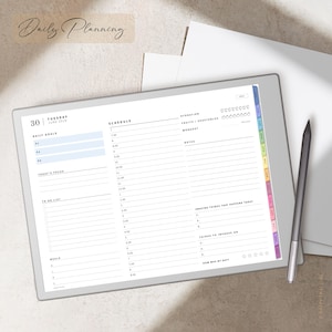 May include: A digital planner displayed on a tablet with a stylus. The planner includes sections for daily goals, schedule, and notes. The tablet has a white border and a colourful tab on the side. The text "Daily Planning" is at the top.