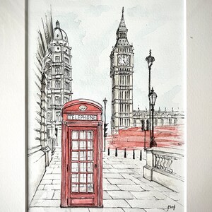 Red telephone booth and Big Ben watercolor art print, framed and ready to hang in a modern interior