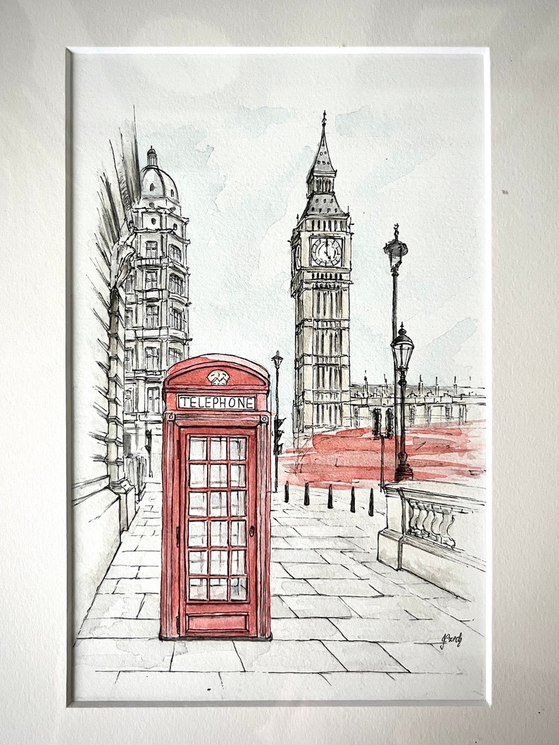 Red telephone booth and Big Ben watercolor art print, framed and ready to hang in a modern interior