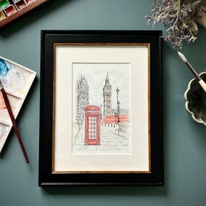 Framed London street scene with red phone booth, unique wall art print for contemporary interiors