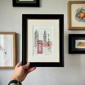 Cityscape art print of London in a classic frame, perfect for gallery wall in retro or loft-style interiors