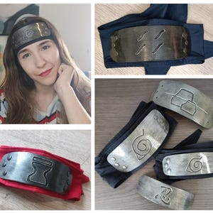 May include: Several silver-coloured headbands with engraved symbols, displayed on red and black fabric. One headband is worn by a person. These headbands are likely cosplay accessories.