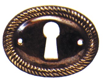 May include: An oval-shaped keyhole cover with a rope-like design around the edge. The cover is made of a dark metal and has a keyhole in the center.