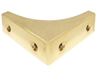 May include: A brass corner brace with three screw holes. The brace is a right angle and has a rounded edge.