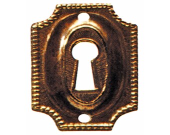 May include: A gold-toned keyhole cover with a decorative, ornate border. The cover has a rectangular shape with rounded corners and a keyhole in the center.