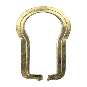 May include: A gold-coloured keyhole cover with a double-layered design.