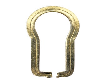 May include: A gold-colored keyhole cover with a double-layered design.