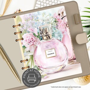 May include: A digital print featuring a round pink perfume bottle with the text "CHANEL CHANCE" on a label. The image includes a floral arrangement of pink and blue flowers, a pink purse, and the text "PRINT AT HOME INSTANT DOWNLOAD".