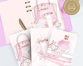 May include: Pink and gold planner pages with illustrations of a handbag, coffee cup, perfume, and watch. The pages are in a pink binder with a gold pen. Text includes "PRINT AT HOME" and "INSTANT DOWNLOAD".
