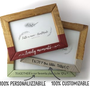 May include: Three wooden picture frames with painted accents. One frame has a red accent, another a green accent, and a third a gray accent. The frames have the phrases "lovely moments" and "ENJOY the little THINGS" written on them. The bottom of the frames read "TOGETHER is our favourite place to be".