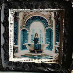 May include: A framed cross-stitch artwork depicting a woman in a blue dress sitting in a bathtub in a blue and white tiled room. The artwork is framed in a black frame with a decorative border.