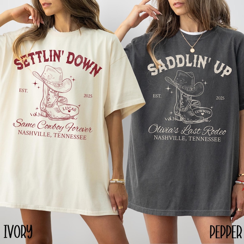 May include: Two oversized t-shirts with a vintage-inspired design. The ivory t-shirt features the text "Settlin' Down" with a cowboy boot graphic and the text "Same Cowboy Forever" and "Nashville, Tennessee". The gray t-shirt features the text "Saddlin' Up" with a cowboy boot graphic and the text "Olivia's Last Rodeo" and "Nashville, Tennessee".