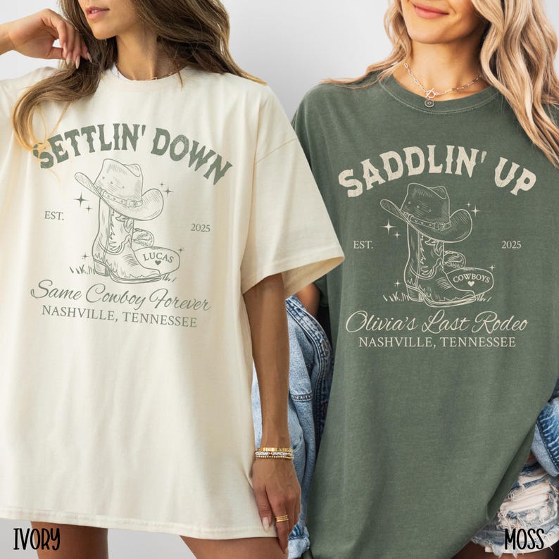 May include: Two t-shirts with a cowboy boot graphic and text. The ivory t-shirt says "Settlin' Down" with the text "Lucas" and "Same Cowboy Forever" below the boot. The moss green t-shirt says "Saddlin' Up" with the text "Cowboys" and "Olivia's Last Rodeo" below the boot.