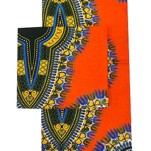 May include: An orange dashiki fabric with a detailed pattern in black, yellow, and blue. The design includes geometric shapes and floral motifs. The fabric is folded and displayed, showcasing the intricate design.