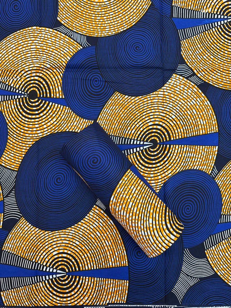 May include: A vibrant fabric featuring a repeating pattern of concentric circles in shades of navy blue, yellow, and black. The design includes curved lines and geometric shapes, creating a bold and eye-catching textile.
