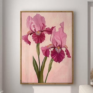 May include: A painting of two pink irises with dark purple centers on a light pink background. The painting is framed in a light wood frame.