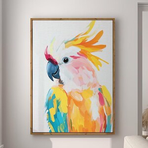 May include: A colorful painting of a cockatoo with a pink, yellow, and blue plumage. The bird is facing left and has a white crest. The painting is framed in a wooden frame.