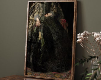 May include: A framed painting of a woman wearing a dark green and gold dress. The woman is sitting in a chair and her hands are folded in her lap. The painting is set against a dark green wall and a wooden table.