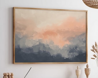 May include: A framed abstract landscape painting with a wooden frame. The artwork features a blend of peach, gray, and navy blue hues, evoking a sense of a sunset over mountains. The painting hangs above a wooden cabinet.