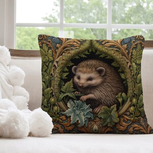 May include: A throw pillow with a detailed illustration of a hedgehog in a leafy, ornate frame. The background is a dark green with gold accents. The hedgehog is brown and white with a pink nose.