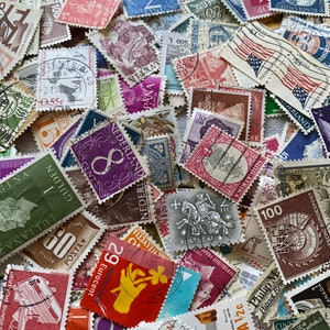 100+ vintage poststamps used great ephemera. Lucky dip collage
