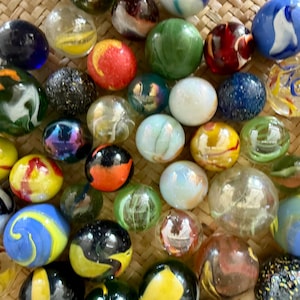 25 large glass marbles real vintage and larger size used but nice condition, boulders