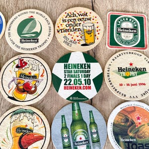 25 sottobicchieri vintage della Heineken. Da tutto il mondo. Marchio di birra olandese. immagine 6