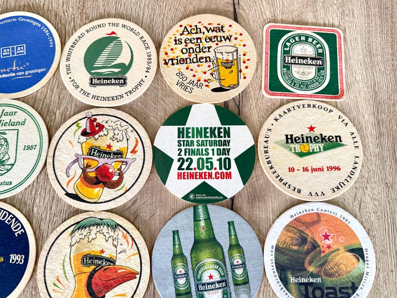 25 sottobicchieri vintage della Heineken. Da tutto il mondo. Marchio di birra olandese. immagine 6