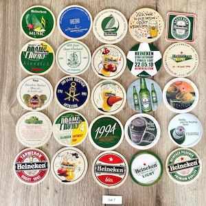 25 sottobicchieri vintage della Heineken. Da tutto il mondo. Marchio di birra olandese. Set 1