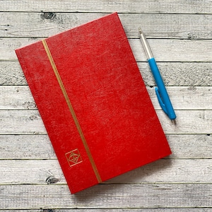 Poststamp album a6 format. Nice condition, and very red