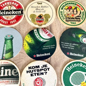 25 sottobicchieri vintage della Heineken. Da tutto il mondo. Marchio di birra olandese. immagine 18