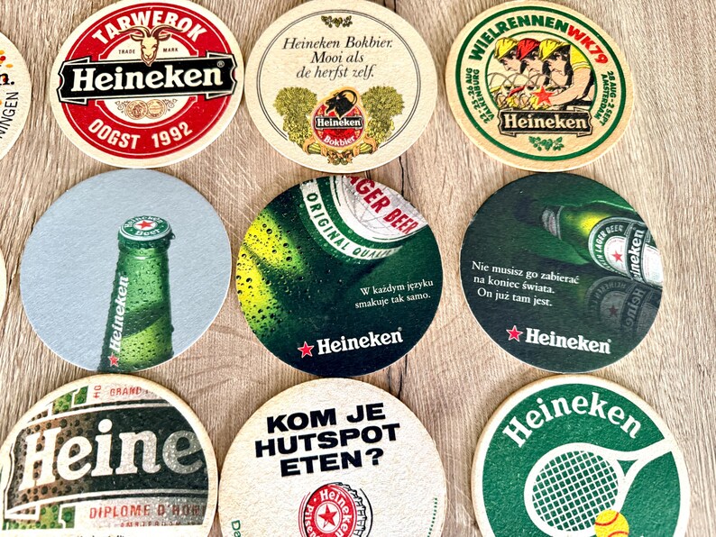 25 sottobicchieri vintage della Heineken. Da tutto il mondo. Marchio di birra olandese. immagine 18