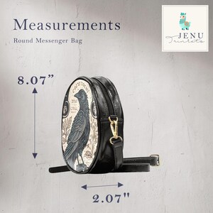 May include: Round messenger bag with a raven illustration. The bag is black with a decorative panel featuring a detailed raven design. The bag is 8.07 inches high and 2.07 inches wide, with a long adjustable strap and gold-colored hardware.