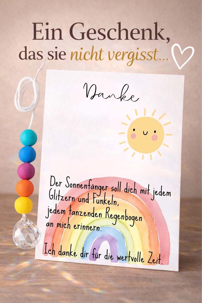 May include: A white greeting card featuring a yellow sun illustration, a watercolor rainbow, and German text. The card includes the words Danke, Ein Geschenk, das sie nicht vergisst, and a poem. A string of colorful beads with a clear crystal pendant is attached.