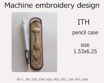 May include: Machine embroidery design for an ITH pencil case featuring a gold cat with a heart. The design is 1.53 inches by 6.25 inches. The design is available in JEF+, JEF, DST, EXP, HUS, PES, PEC, VIP, VP3, and XXX formats.