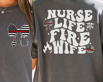 May include: Gray t-shirt with the words "NURSE LIFE FIRE WIFE" in white, with a bow and stethoscope graphic. The bow features an American flag design with a red stripe, and a firefighter's emblem.