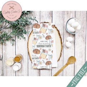 May include: A white kitchen towel with a repeating pattern of jars of sourdough starter, loaves of bread, and flowers. The text on the towel reads "Sorry I can't I have to feed my sourdough starter".