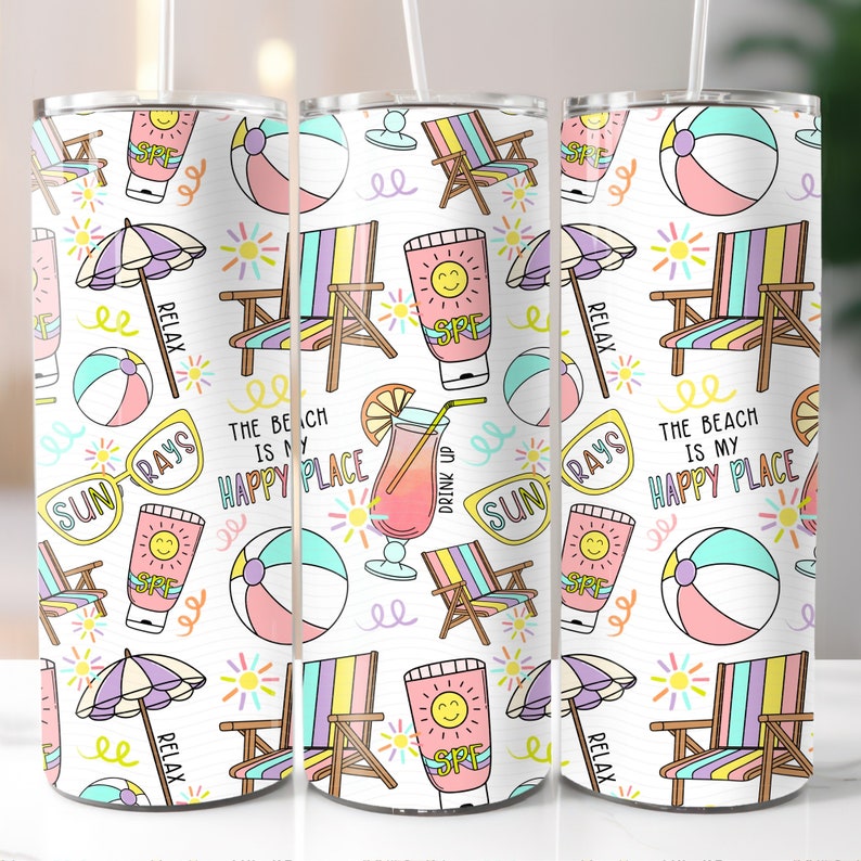 May include: White tumbler with a colourful beach-themed design. The design includes beach chairs, sunglasses, beach balls, umbrellas, and a drink with a lemon wedge. The text on the tumbler reads "The beach is my happy place".